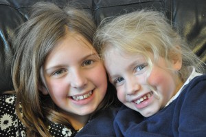 Day 30: A very tired Mimi having a cuddle with big sister Sophie (who arrived for a surprise visit!)