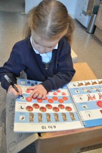 Day 250:  Lola practising writing her numbers and being so proud of herself when she got them all right