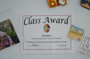 Day 415:  Ella was awarded the Class Award this week and received a certificate and trophy for her literacy work