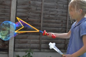 Day 468:  Playing with giant bubbles in the garden