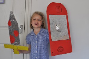 Day 474:  Ella with her home-made Roman sword and shield for a school project.  I only helped her with a couple of bits (double-sided tape can be really tricky for little fingers!) and she's really proud of all her hard work.