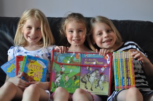 Day 481:  The girls got brilliant school reports, and as is now becoming a tradition, they got new books each as a reward for working so hard and trying their best.  I think their smiles show how thrilled they are!