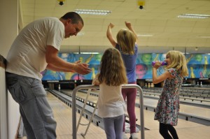 Day 543: Torrential rain today, so we headed for the bowling alley. I love this photo of everyone celebrating :)